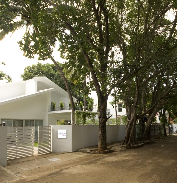 white house surrounded by trees, sangam house in India
