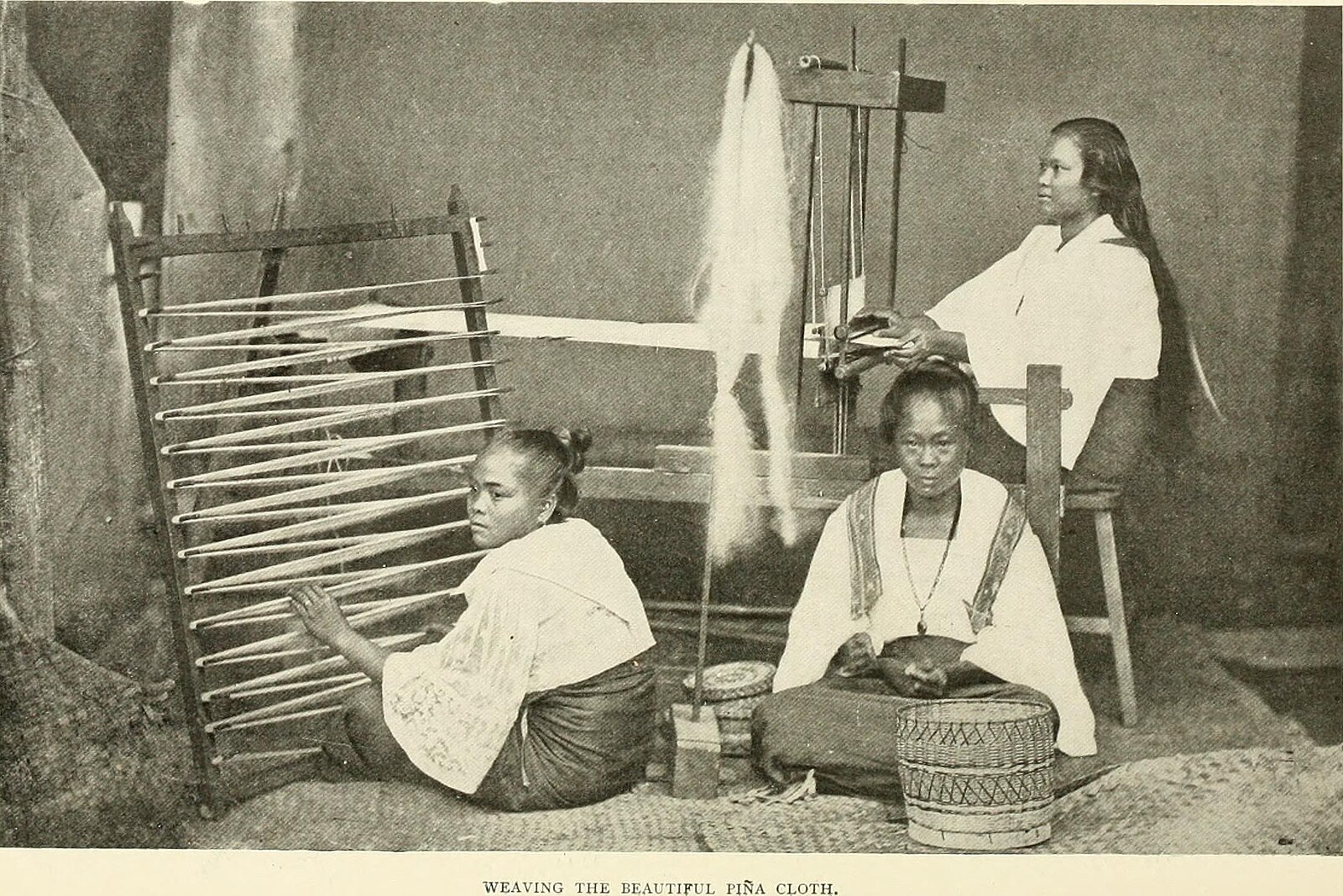 Women pi&ntilde;a weavers from Panay Island at the turn of the 20th century. Photo &copy; Ramon Reyes Lala, The Philippine Islands.